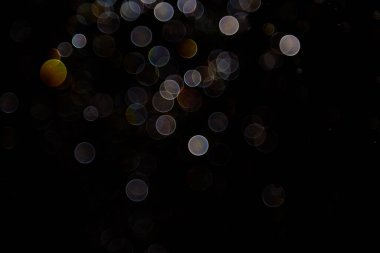 Siyah arkaplanda ışık bokeh