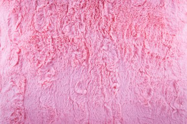 Arka plan için pembe yapay kürk yumuşak ve solucan dokusu