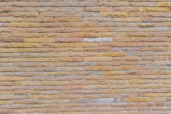 Gelbe Steinmauer Mit Steinblöcken Als Hintergrund — Stockfoto