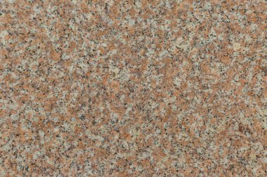 Parlak pembe granit arka plandan oluşan eski bir duvarın granit dokusu