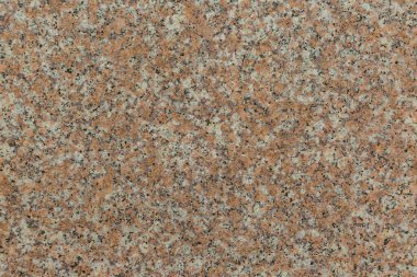 Parlak pembe granit arka plandan oluşan eski bir duvarın granit dokusu