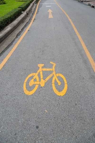 Bike lanes and yellow bike symbol, Bike alley in public park Garden background