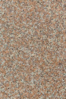 Parlak pembe granit arka plandan oluşan eski bir duvarın granit dokusu