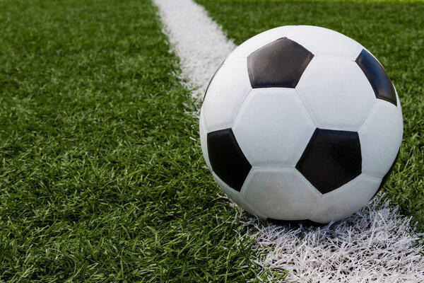 soccer ball in the field on the white line background