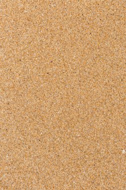 Yazın kumsalda ıslak kum dokusu deseni yakın çekim.