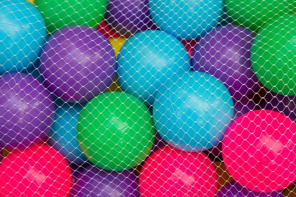 White Net Cover Mesh Bag Put Colorful Ball Background — Stock Photo, Image