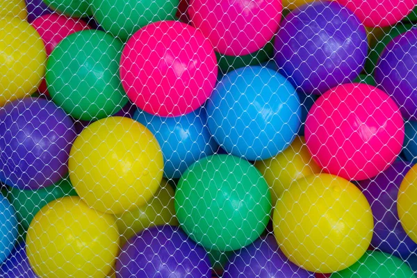 White Net Cover Mesh Bag Put Colorful Ball Background — Stock Photo, Image
