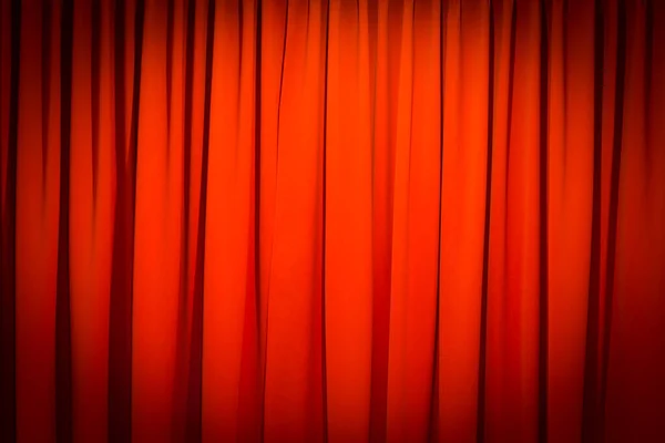 Red closed curtain with a light spot use for background