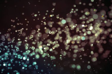 Siyah arkaplan üzerindeki soyut bokeh dokusu