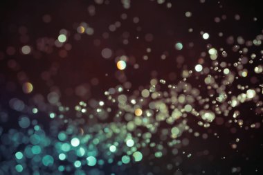 Siyah arkaplan üzerindeki soyut bokeh dokusu