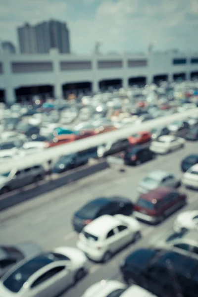 Vintage blur of car at public car parking background