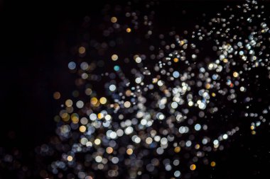 siyah arka plan üzerinde renkli bokeh