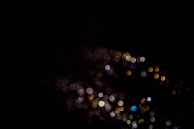 siyah arka plan üzerinde renkli bokeh