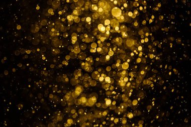 Görünür altın noktalı bulanık fotoğraf ışıl ışıl parlıyor. Duvar kağıdı olarak kullanılabilecek kadar lüks görünüyor.