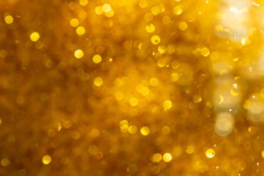 Arkaplan için siyah kullanımda altın bokeh bulanıklığı giderici