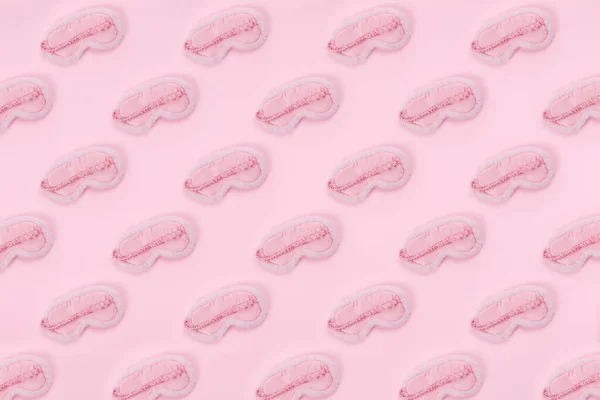 Pattern of cute pink fluffy sleep mask on pink drop — Stock Photo, Image