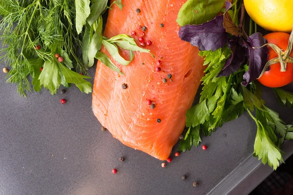 Salmon woth seasoning on a pan — Stock Photo, Image