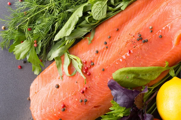 Salmon with seasoning on a pan — Stock Photo, Image