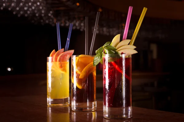 Cherry bomb, screwdriver and cuba libre cocktails in a tall glas — Stock Photo, Image