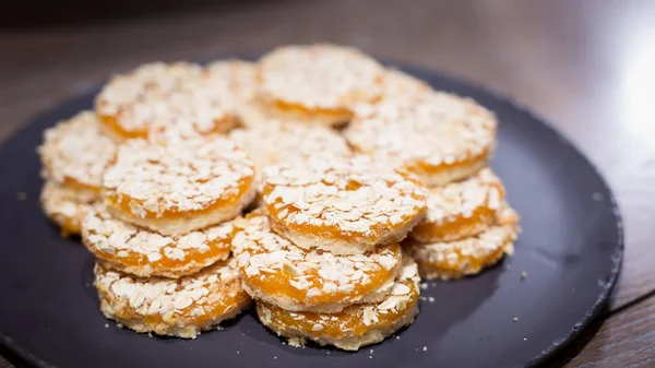 Apricot cookies on wooden table — Stock Photo, Image