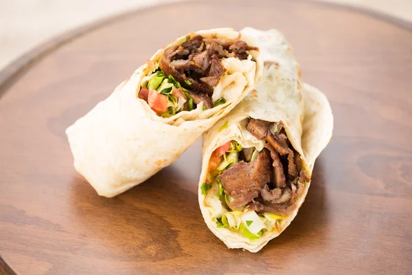 Doner kebab on wooden background — Stock Photo, Image