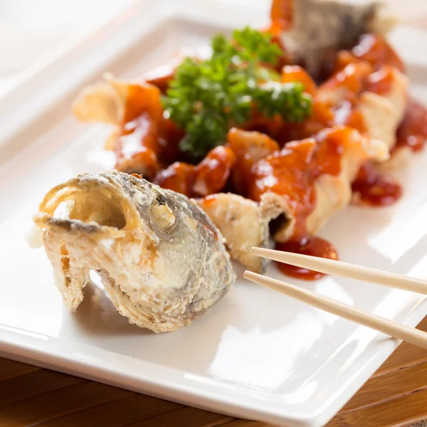 Japanese style fried sea bass, served with sweet and sour sauce — Stock Photo, Image