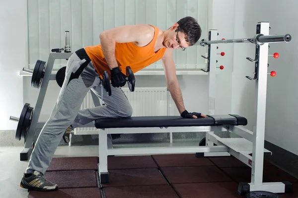 Exercises for the hands with dumbbells — Stock Photo, Image