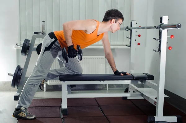 Exercises for the hands with dumbbells — Stock Photo, Image