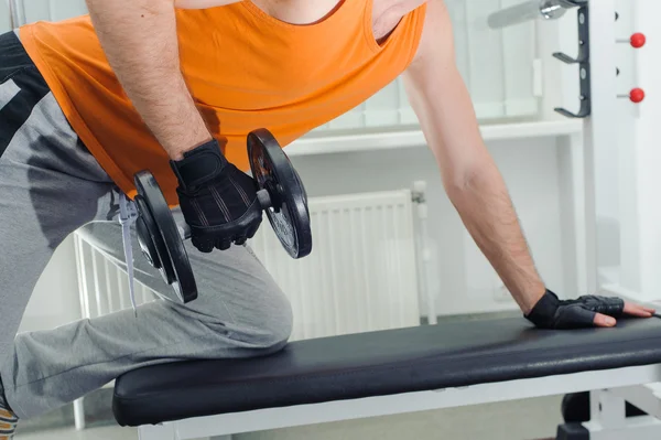 Exercises for the hands with dumbbells — Stock Photo, Image