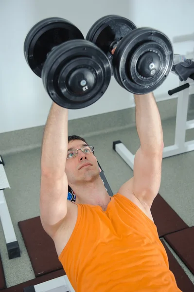 Exercises for the hands with dumbbells — Stock Photo, Image