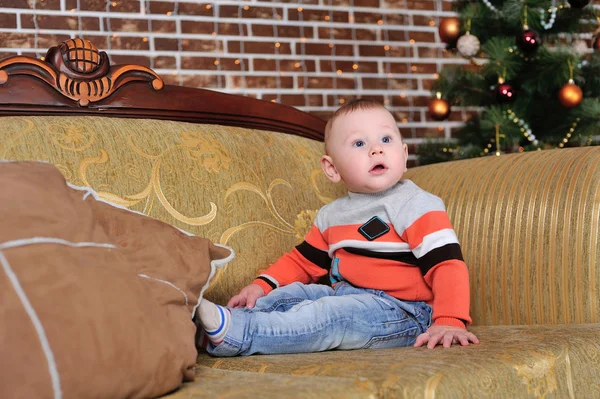 Child near the Christmas tree — Stock Photo, Image