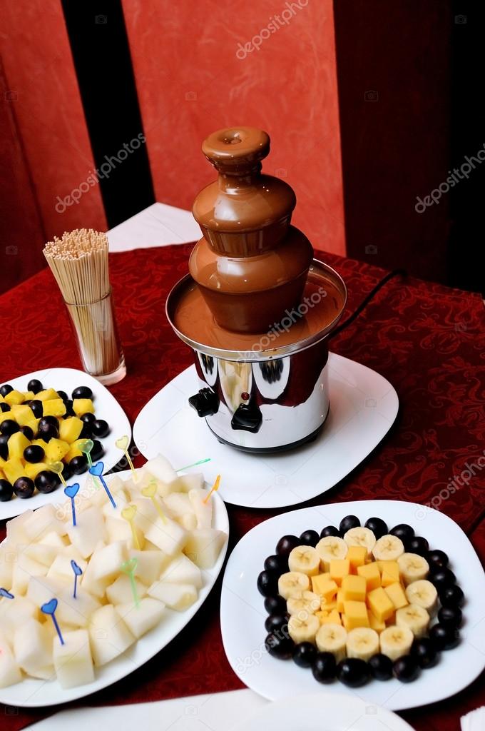 Chocolate Fountain And Fruits At Wedding Reception Stock Photo