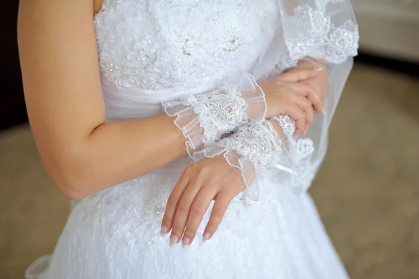 Hands of bride in gloves — Stock Photo, Image