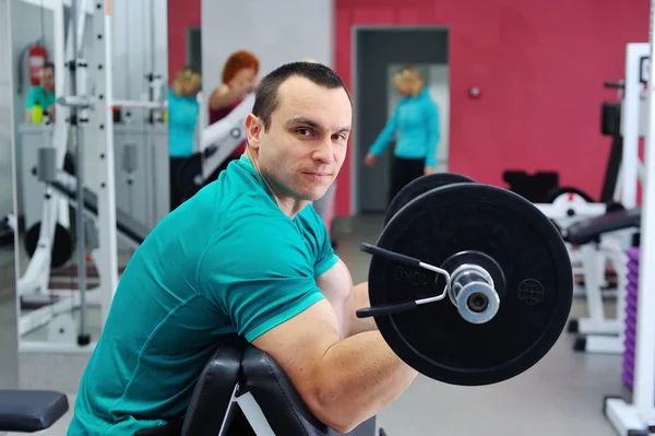 Exercises for the biceps barbell — Stock Photo, Image