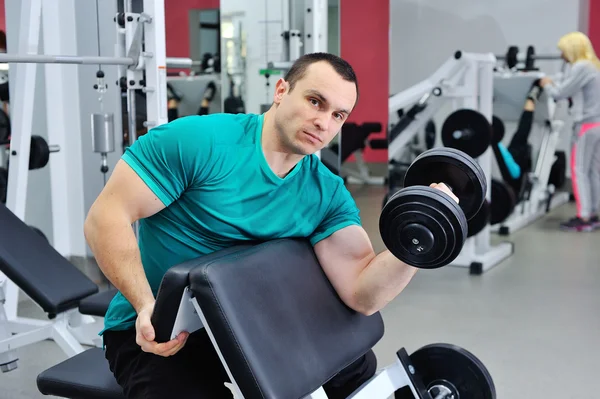 Exercises for the biceps with dumbbells — Stock Photo, Image
