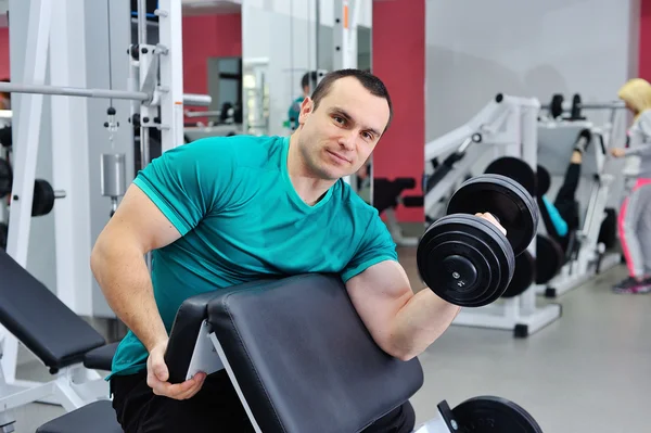 Exercises for the biceps with dumbbells — Stock Photo, Image