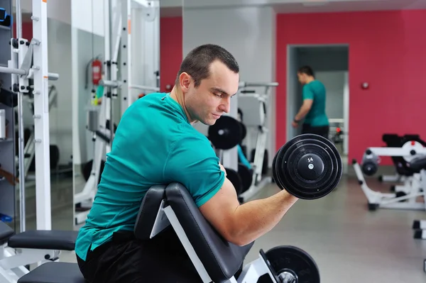 Exercises for the biceps with dumbbells — Stock Photo, Image