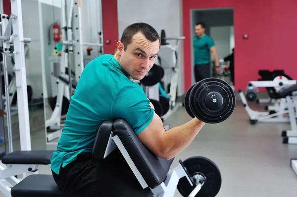 Exercises for the biceps with dumbbells — Stock Photo, Image