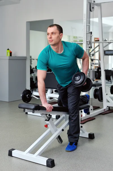 Image of fitness guy in gym exercising with dumbbells Stock Photo