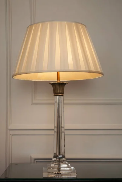 Decorative table lamp on dresser