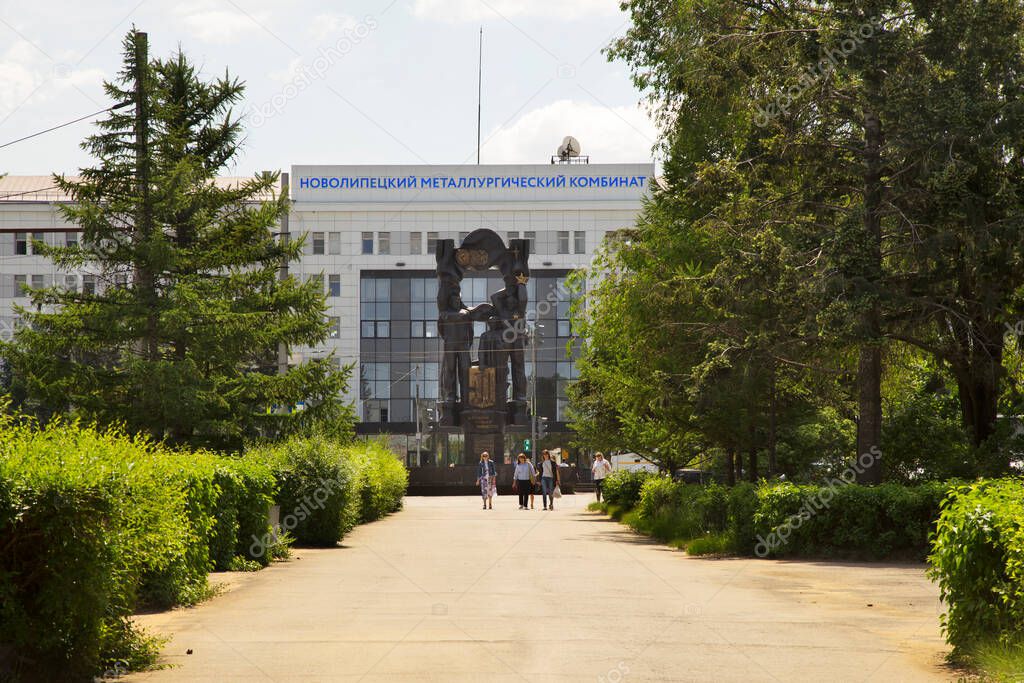 Monument 50 years NLMK and Main administrative building of Novolipetsk metallurgical combine in Lipetsk. Russia