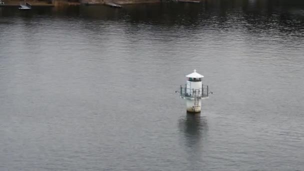 Small lighthouse on open baltic sea — Stock Video