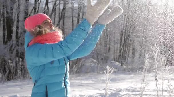 Happy young woman playing with snow — Stock Video