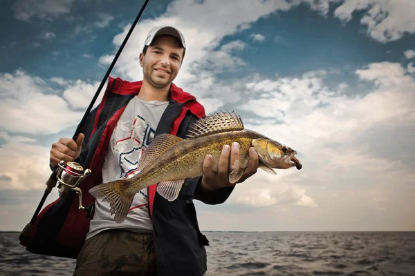 Angler with pike — Stock Photo, Image