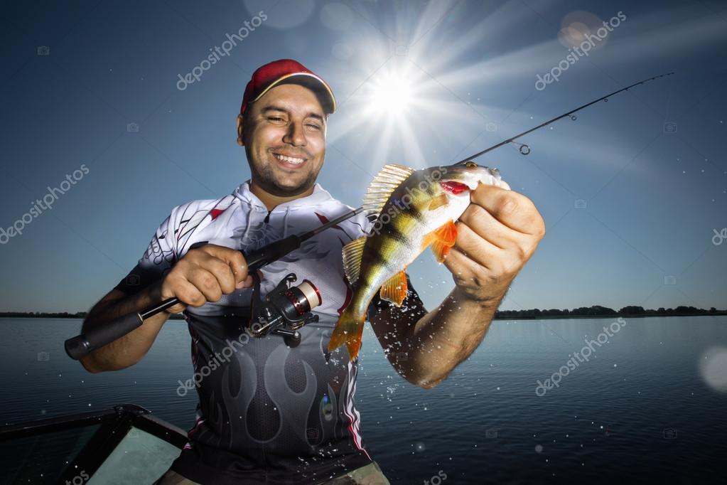 Angler with perch Stock Photo by ©Vitaliy_Melnik 52375041