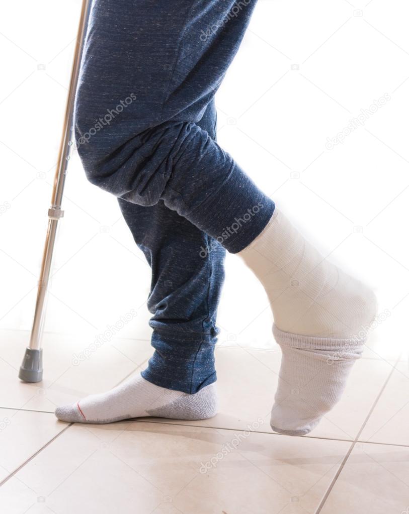 Young man with a broken ankle and a leg cast — Stock Photo © dnaveh  #111171960, image size:813x1023
