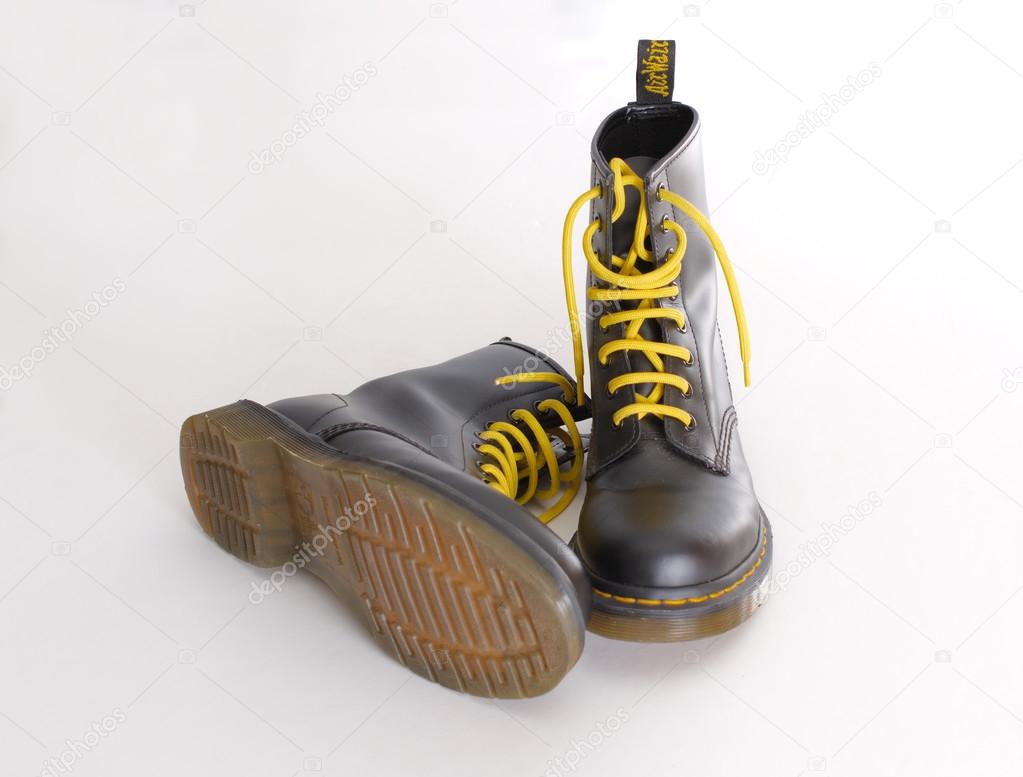 black boots with yellow laces