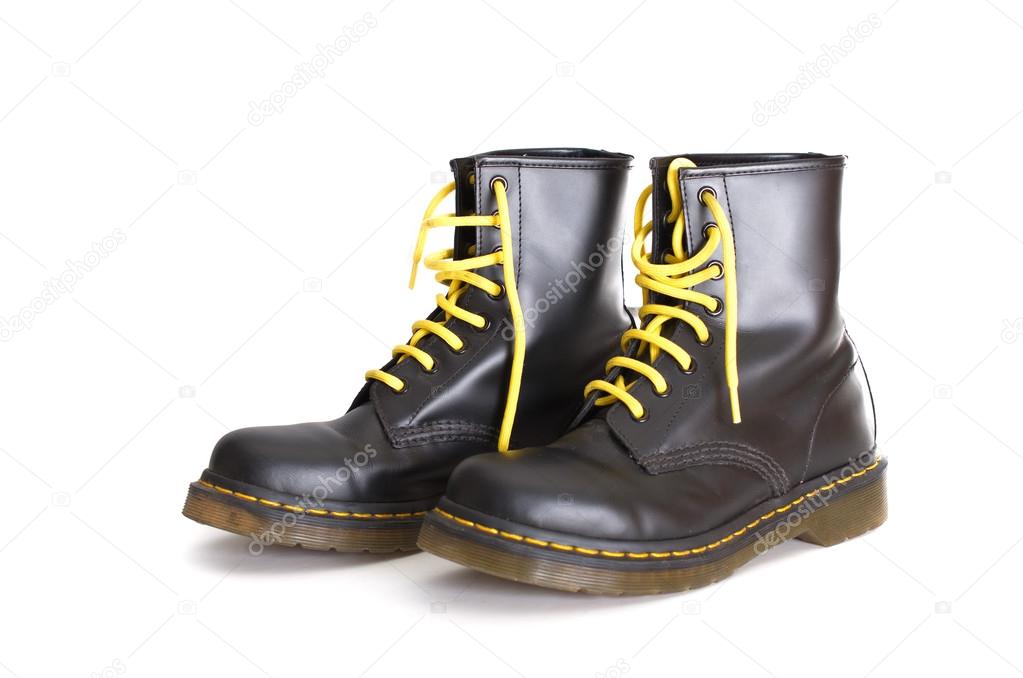 Classic black lace-up boots with yellow laces