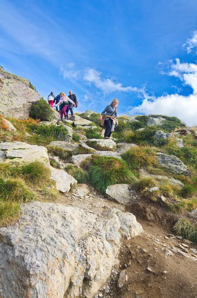 People hiking to the three lakes of Tristaina in Andorra — Stock Photo, Image