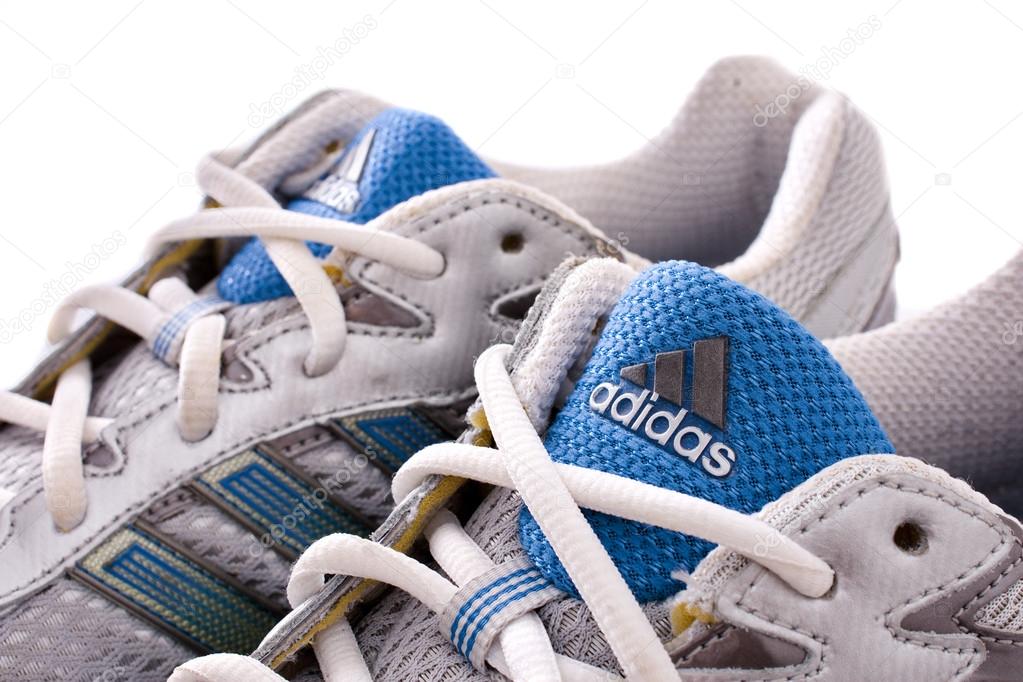 NEW YORK - May 22, 2015: Adidas running shoes - sneakers - trainers, in gray and blue, showing the Adidas logo and famous three stripes - illustrative editorial